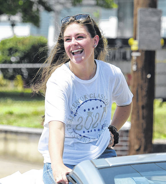 <p>Pittston Area graduate Olivia Grochal is shown atop of a car during the Duryea parade celebrating 2020 area high school graduates from Duryea.</p>
<p>Tony Callaio | For Sunday Dispatch</p>