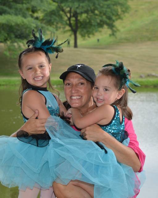 <p>Gina Malsky, artistic director of Ballet Theatre of Wilkes-Barre, gets a hug from two of her younger dancers, Gianna and Aubrey Ellman.</p>
<p>Submitted photo</p>