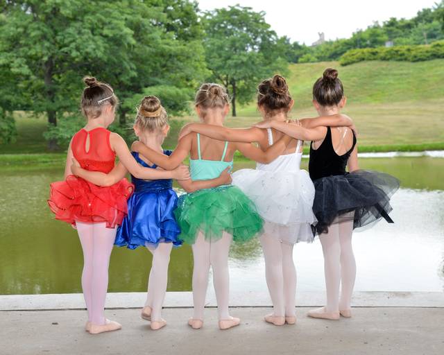 <p>Some of the younger dancers gaze into the pond at Kirby Park during a pre-show photo session.</p>
<p>Submitted photo</p>
