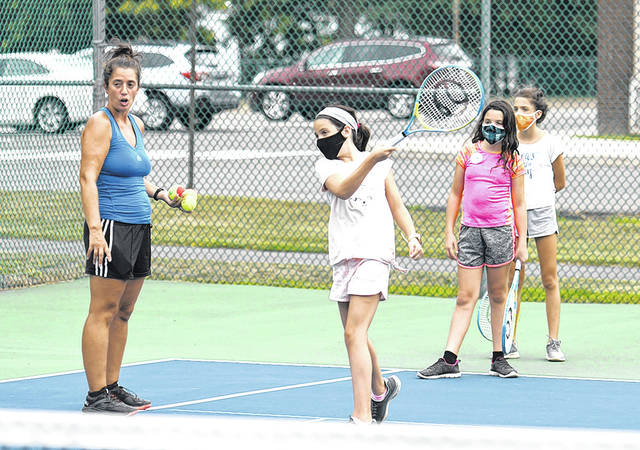 <p>Tennis instructor Tiffany Callaio watches campers work on their forehand shots.</p>
<p>Tony Callaio | For Sunday Dispatch</p>