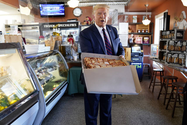 125530076_web1_AP20233762007669
President Donald Trump holds a pizza during a visit to Arcaro and Genell restaurant after speaking at a campaign event on Thursday in Old Forge.
Evan Vucci | AP photo
