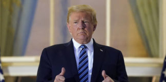 
			
				                                President Donald Trump stands on the balcony outside of the Blue Room as returns to the White House on Monday after leaving Walter Reed National Military Medical Center, in Bethesda, Md.
                                 Alex Brandon | AP photo

			
		