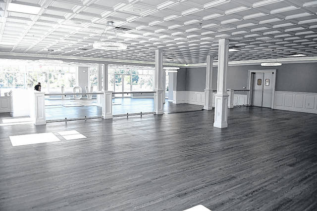 <p>The interior of the former Cooper’s Seafood Restaurant was completedly gutted and unrecognizable. Co-partner Jamie Granko is shown in the distance laying out the dance floor for the first wedding held on Oct. 3.</p>
<p>Tony Callaio | For Sunday Dispatch</p>