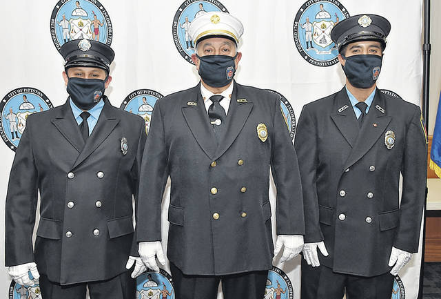 <p>Frank Roman, center, was elevated to fire chief and Joseph Chiumento, left, and John Lombardo were sworn in on Nov. 18 as fulltime firefighters with the City of Pittston in a ceremony at Pittston Memorial Library.</p>
<p>Tony Callaio | For Times Leader</p>