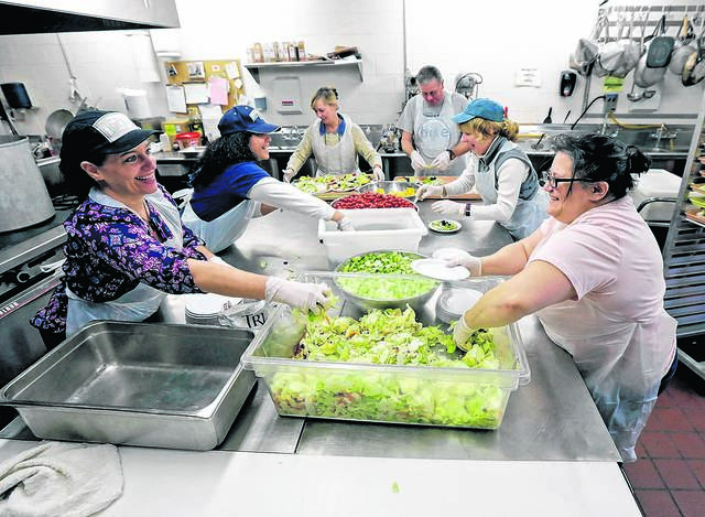 126057550_web1_TTL112516ThanksgivingMeals_1_HTML
Volunteers prepare salads for Thanksgiving meals at St. Vincent De Paul Kitchen in Wilkes-Barre in this file photo. Catholic Human/Social Services of the Diocese of Scranton will provide free, takeout Thanksgiving meals Thursday at two locations, including this one.
Times Leader photo