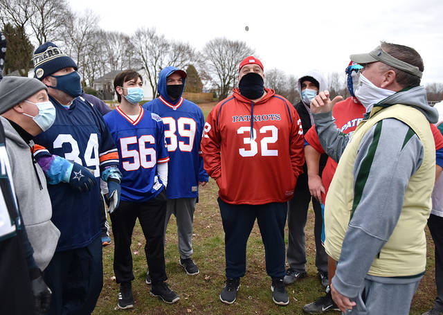 <p>Special guest Wyoming Area football Head Coach Randy Spencer, right, does the honor of doing the pre-game coin toss at the annual Turkey Bowl Game in support of the Greater Pittston Santa Squad.</p>
<p>Tony Callaio | For Sunday Dispatch</p>