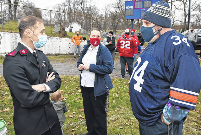 <p>The West Pittston Salvation Army’s Lts. Gavin and Holly Yeatts speak with Tony Marranca of the Santa Squad.</p>
<p>Tony Callaio | For Sunday Dispatch</p>
