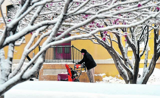 126160818_web1_TTL111718snow1
John Walski snow blows the lot at the Westmoreland Club in Wilkes-Barre during a 2017 winter storm. Were bracing for another big one, but as always forecasted snowfall totals vary.
Times Leader file photo