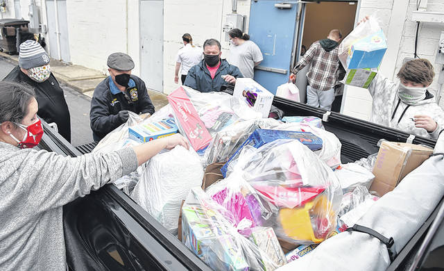126175882_web1_Santa-Dropoff-2020-1
The Greater Pittston Santa Squad delivered five truckloads of toys to the West Pittston Salvation Army toy drop-off center at the Insalaco Shopping Center in West Pittston.
Tony Callaio | For Sunday Dispatch
