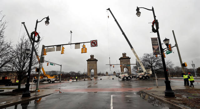 <p>A pair of cranes and a crew of workers begin setting the ribs for floodgate panels early Christmas morning on the Market Street Bridge along River Street in Wilkes-Barre.</p>
<p>Fred Adams | For Times Leader</p>