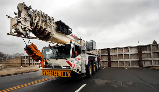 <p>The crane on the Kingston side of the Market Street Bridge gets ready to pull away after finishing installing the floodgates on Christmas Day.</p>
<p>Fred Adams | For Times Leader</p>