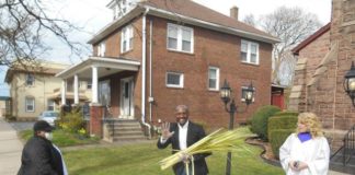 
			
				                                Pastor Adam McGahee, center, and his wife, Lisa, were giving out palm branches outdoors in front of Moving River Ministries, 439 S. Main St., Wilkes-Barre last year. The church’s Praise Team will be handing them out again this year, from 10 a.m. to noon on March 28.
                                 Mary Therese Biebel | Times Leader file photo

			
		