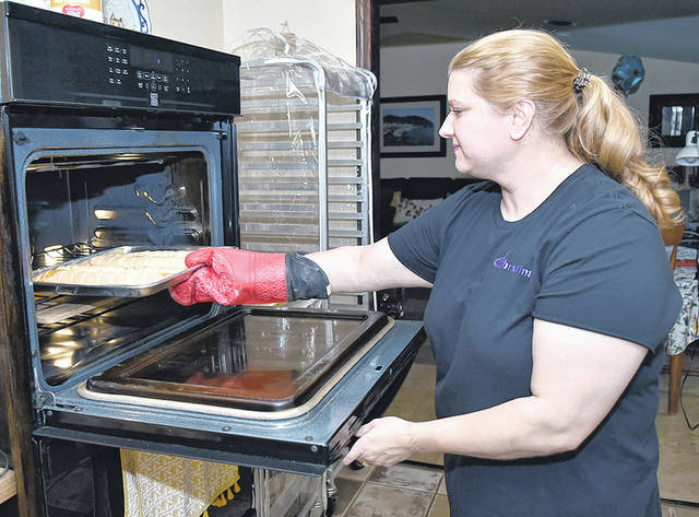 126939204_web1_Rock-House-Cookies-A
Christina Kasa Russo takes freshly made danishes out of oven. On this day, she made strawberry and apricot danishes. Her bakery, Rock House Cookies LLC, has made to order cookies, breads and cakes.
Tony Callaio | For Sunday Dispatch