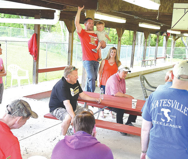 <p>Little Guy DePascale, center, president of the Yatesville Bocce League, welcomes returning and new players to the 2021 bocce season. DePascale is holding his 18-month-old son, Guidon DePascale III.</p>
<p>Tony Callaio | For Sunday Dispatch </p>