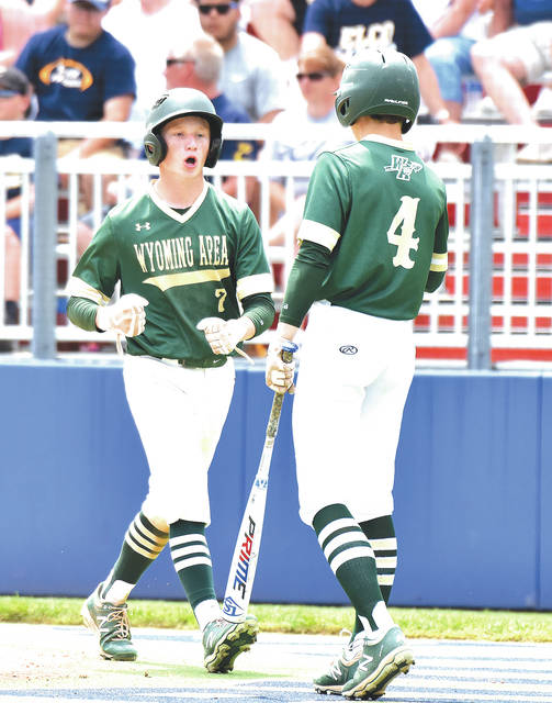 <p>Jack Mathis (4) congratulates Casey Noone (7) after Noone scored for the Warriors. Mathis and Noone combined for five of the eight Wyoming Area hits against ELCO in PIAA AAAA quarerfinal action.</p>
<p>Tony Callaio | For Times Leader</p>