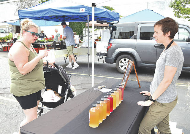 127345909_web1_Pittston-2021-Farmer-s-Market-5-copy
High Point Kombucha owner and brewer, Laura Valasakos, right, talks about her drink product to Clourtney Zielinski.
Tony Callaio | For Sunday Dispatch