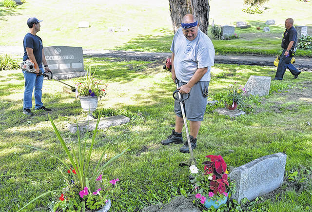 <p>Pittston City Fire Chief Frank Roman, center, and John Lombardo, left, weedwack at the Pittston Cemetery while Assistant Fire Chief Mike Chernouskas, right, assists in the clean up.</p>
<p>Tony Callaio | For Sunday Dispatch</p>