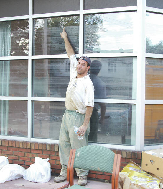 <p>Dr. Frank Colella points to the record crest line left from Tropical Storm Lee at his former chiropratic office at the corner of Wyoming and Exeter Avenues, West Pittston.</p>
<p>Tony Callaio | For Sunday Dispatch</p>