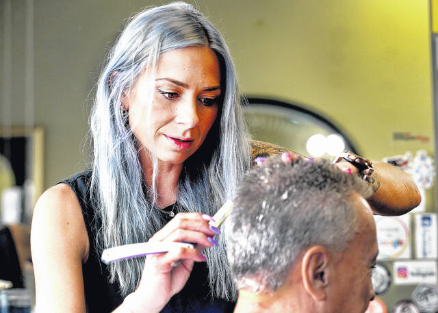 127645535_web1_barber1_faa
Nicole Prunka, co-owner of Rob & Nicoles Barber Shop 901, works on a customer in the shop located at 901 Wyoming Ave., Wyoming.
Fred Adams | For Sunday Dispatch