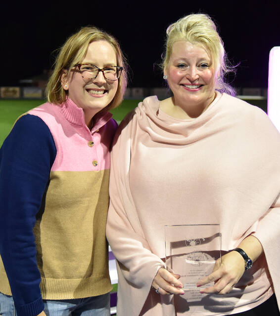 <p>Kristina McHale, right, receives the Celebration of Life Award from Paint Pittston Pink co-founder Barbara Sciandra, left, in honor of her parents John ‘Jack’ McHale and Rosemary McHale.</p>
<p>Tony Callaio | For Times Leader</p>