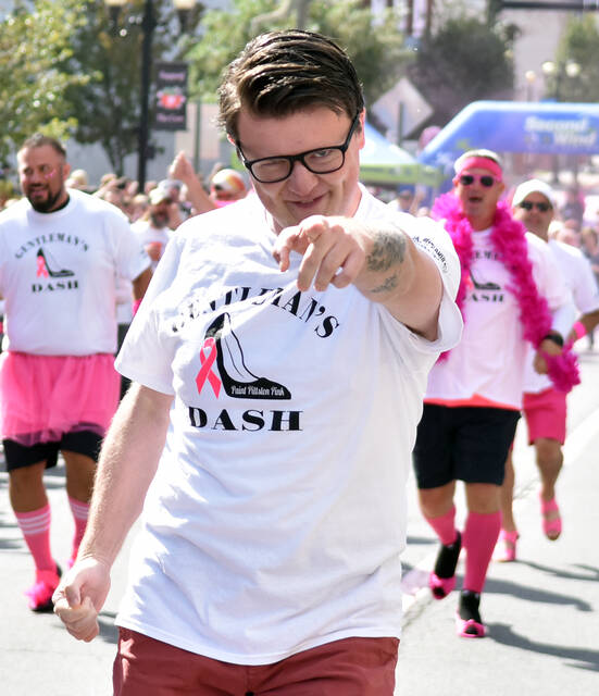 <p>Gentlemen’s Dash participant Patrick Kernan, a Times Leader reporter, points to the camera has he finished a respectable middle of the pack.</p>
<p>Tony Callaio | For Times Leader</p>