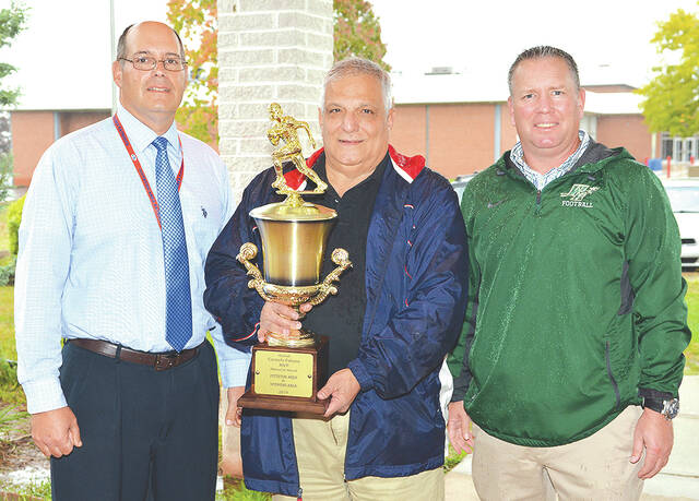 127758912_web1_Falcone-Award-Recipients-Sought-2-copy
Pittston Area head football coach Nick Barbieri, left, and Wyoming Area head coach, Randy Spencer, stand with Carmen Falcone holding the Carmello Falcone MVP Memorial Award. The trophy goes to the most valuable player of the annual Pittston Area-Wyoming Area game. Past Falcone MVP recipients are asked to attend the game for a group photo prior to and after the game.
Tony Callaio file photo