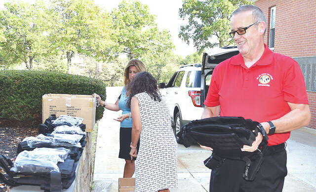 <p>Wyoming Area Kiwanis Club (WAKC) board member Mike Coolbaugh is shown delivering 16-rifle proof vests to municipalities encompassing the Pittston Area School District this past week. To date, WAKC has donated, through fundraising, 158 vests to Greater Pittston EMS personnel.</p>
<p>Tony Callaio | For Sunday Dispatch</p>