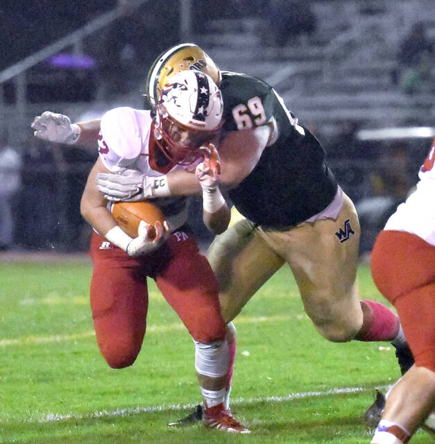 <p>Wyoming Area lineman and Falcone game MVP Nick Elko (69) stops Pittston Area’s Drew Menendez (22) in the backfield for a loss.</p>
<p>Tony Callaio | For Times Leader</p>