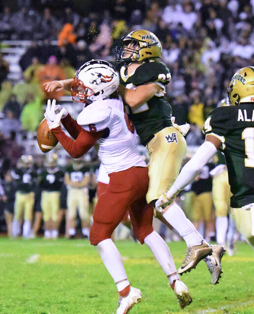 <p>Wyoming Area’s Leo Haros (22) breaks up a pass intended for Pittston Area’s Harry Pugliese (6).</p>
<p>Tony Callaio | For Times Leader</p>