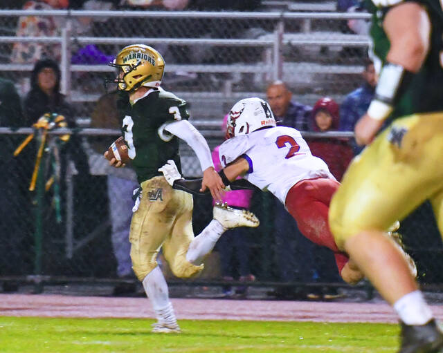 <p>Wyoming Area’s Rocco Pizano (3) eludes a tackle attempt by Pittston Area’s Kevin Lockett on his 68-yard touchdown run early in the third quarter Friday night.</p>
<p>Tony Callaio | For Times Leader</p>