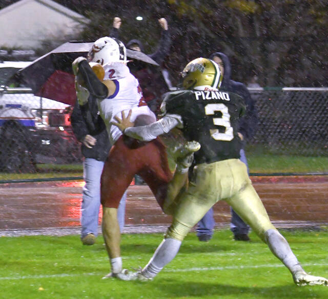 <p>Pittston Area’s Kevin Lockett (2) hangs on to the football on a 15-yard touchdown catch in the third quarter Friday night with Wyoming Area’s Rocco Pizano defending.</p>
<p>Tony Callaio | For Times Leader</p>