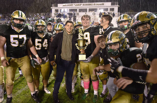 127827860_web1_WA-PA-ftbl-7
Wyoming Area senior lineman Nick Elko (69) is the 2021 Carmelo Falcone MVP winner presented by Carmelos grandson Sam Falcone.
Tony Callaio | For Times Leader