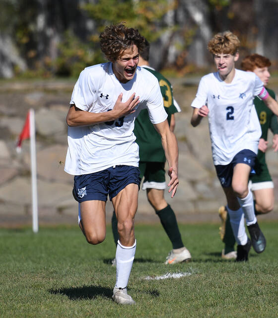 127863011_web1_WA-Sem-BS-Championship-1
Wyoming Seminary freshman Matthew Swartz (33) celebrates after scoring the first of his two goals for the Blue Knights in their District 2 title win over Wyoming Area on Friday.
Tony Callaio | For Times Leader