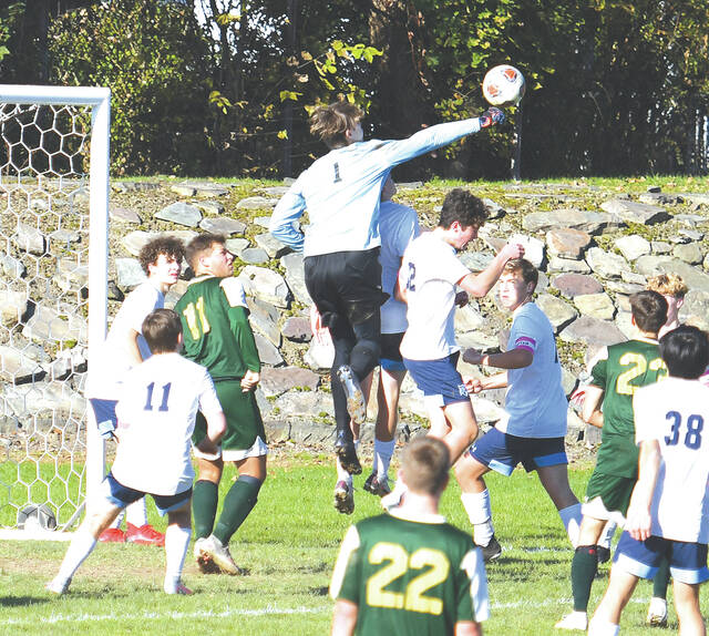 <p>Wyoming Seminary goalie Marc Jackett (1) leaps high in the air to deflect the ball from a Wyoming Area corner shot in the second half.</p>
<p>Tony Callaio | For Times Leader </p>