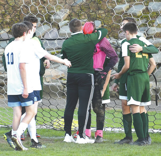 127869408_web1_WA-Sem-BS-Championship-5-copy
Wyoming Area goalie, sophomore Trevor Kruszka, gets consoled by Wyoming Area teammates, coach along with Wyoming Seminary players. Kruszka lost sight of the penalty shot in overtime against Wyoming Seminary as Sem took the District title 3-2 in overtime.
Tony Callaio | For Times Leader