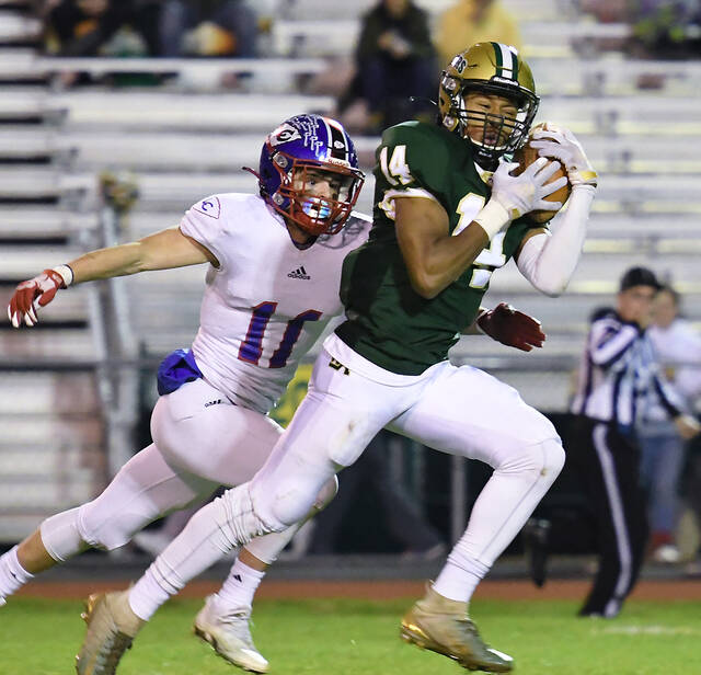 <p>Wyoming Area’s Usamah Alansari (14) catches a 67-yard touchdown pass from quarterback Blaise Sokach-Minnick in the third quarter of Friday night’s District 2 Class 3A semifinal game with Lakeland.</p>
<p>Tony Callaio | For Times Leader</p>