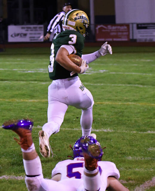 <p>Wyoming Area’s Rocco Pizano (3) finishes off his 88-yard kickoff return for a touchdown in the first quarter Friday night.</p>