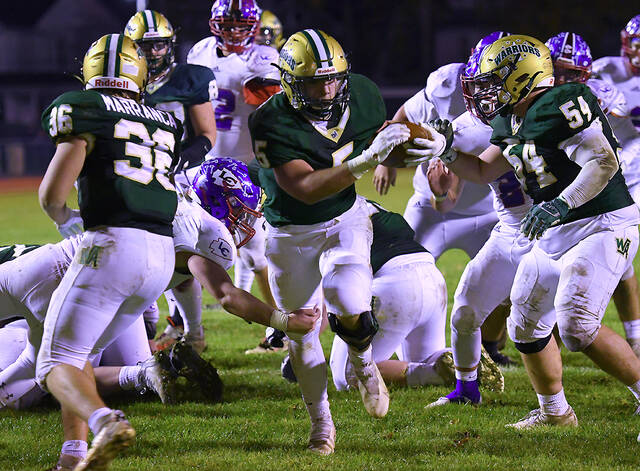127893394_web1_WA-Lakeland-ftbl-4
Wyoming Areas Aaron Crossley (5) blasts through the line for a 5-yard touchdown in the second quarter of Friday nights District 2 Class 3A semifinal game with Lakeland.
Tony Callaio | For Times Leader