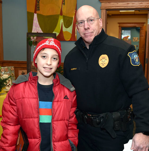 <p>Pittston City Police Chief Neil Murphy participates with to 10-year old Noah Milewski during Pittston’s First Annual Shop with a Cop program. Each child received $100 to shop from any of the participating 40 vendors.</p>
<p>Tony Callaio | For Times Leader</p>