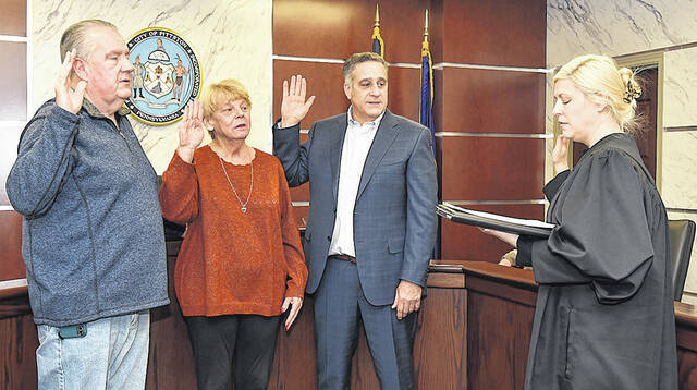 128074973_web1_Pittston-City-2022-Swear-in
The City of Pittston Mayor Michael Lombardo and councilman Kenneth Bang were successful in being re-elected in 2021 along with Donna McFadden-Connors, who returns to council. Left to right: Bangs, McFadden-Connors, Lombardo, District Magistrate Alexandra Kokura-Kravitz officiating on Jan. 3.
Tony Callaio | For Sunday Dispatch