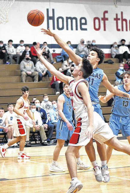 128080192_web1_PA-Dallas-BBB-2
Pittston Areas Dominic Januzzi (42) drives the lane for a lay up with Mountaineer Darius Wallace (11) attempting to block the shot.
Tony Callaio | For Sunday Dispatch