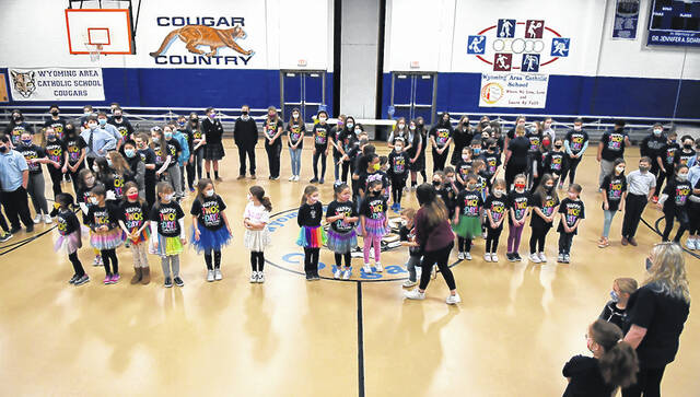 <p>Wyoming Area Catholic faculty guide students into place forming the numbers 2022 on Tuesday, Feb. 22, 2022.</p>
<p>Tony Callaio | For Sunday Dispatch</p>