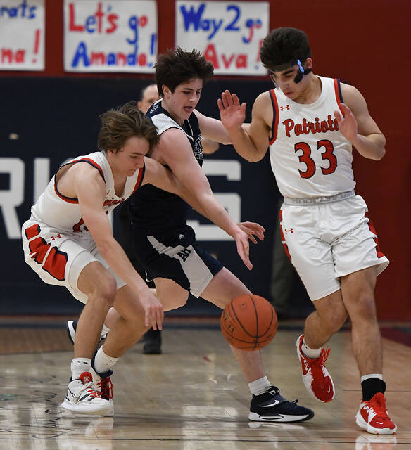 128250133_web1_PA-Abington-BBB-Playoff-1
Patriots JJ Walsh (13) and Anthony Cencetti (33) avoid a collision with Abington Heights Will Marion (12) while going after a lose ball.
Tony Callaio | For Times Leader