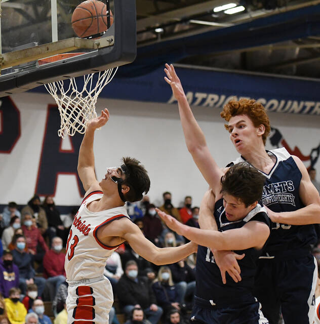 <p>Pittston Area’s Anthony Cencetti (33) gets by Abington Heights’ Will Marion (12) and Bryce Florey (35) to score two of his 13 points.</p>
<p>Tony Callaio | For Times Leader</p>