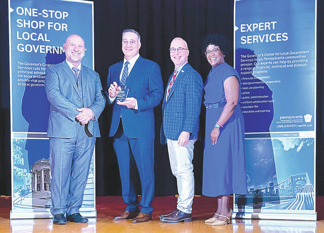 <p>The City of Pittston Mayor Michael Lombardo was recognized for their dedication to public service by Governor Tom Wolf during the governor’s 26th Annual Governor’s Awards for Local Government Excellence. Governement officials presented the award to Lombarod. Standing, left to right: Department of Community and Economic Development (DCED), Deputy Director Richard Vilello, Lombardo, John Brenner, Executive Director of Pennsylvania Municipal League, Kim Bracey, DCED.</p>
<p>Submitted photo</p>