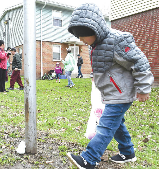 <p>Seven-year-old Michael Carey finds another prize during the Easter Egg Hunt organized by Sherry McHale.</p>
<p>Tony Callaio | For Sunday Dispatch</p>