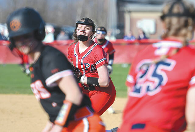 <p>Flex player Maura Mihalka, center, catches a pop fly at 2nd base as she checks the Tunkhannock runner at 1st base.</p>
<p>Tony Callaio | For Sunday Dispatch</p>