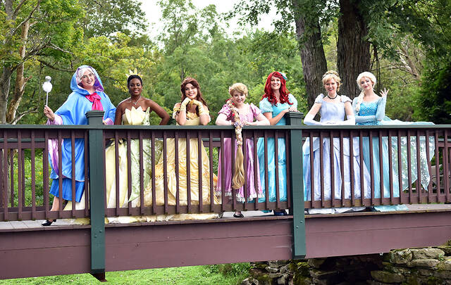 128436916_web1_TL-Princess-Brunch-Bridge
The Times Leader Media Group and The Beaumont Inn are teaming up to host the second annual unique and fun-filled Princess Brunch and Garden Party. Here, the princesses pose from our 2021 event: Fairy Godmother, Tiana from The Princess and the Frog, Belle from Beauty and the Beast, Rapunzel from Tangled, Ariel from The Little Mermaid, Cinderella from Cinderella and Elsa from Frozen.
Times Leader file photo
