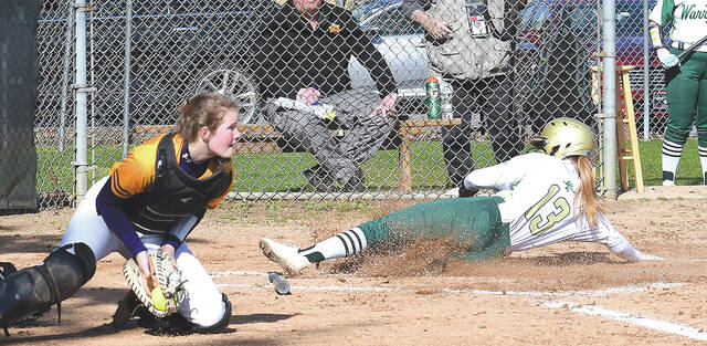 <p>Jocelyn Williams (13) scores a Warrior run after a missed throw to home plate.</p>
<p>Tony Callaio | For Sunday Dispatch</p>