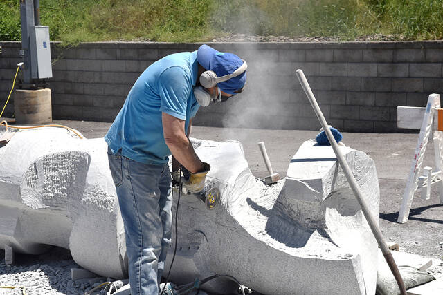 <p>Tony Callaio file photo | For Sunday Dispatch</p>
<p>Sculptor David Green is shown carving out the granite as the piece begins to take shape in the summer of 2020.</p>
<p>Tony Callaio file photo | For Sunday Dispatch</p>